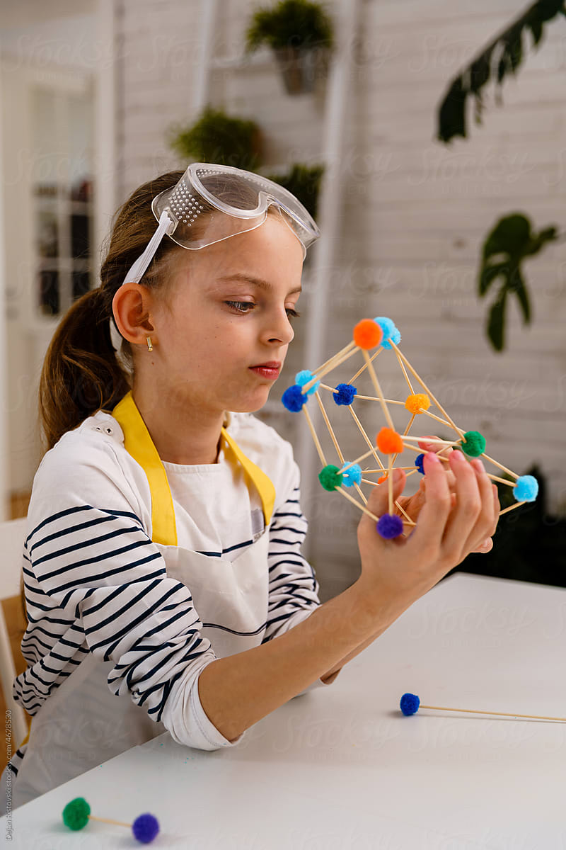 Child making geometric shapes for engineering and STEM concept