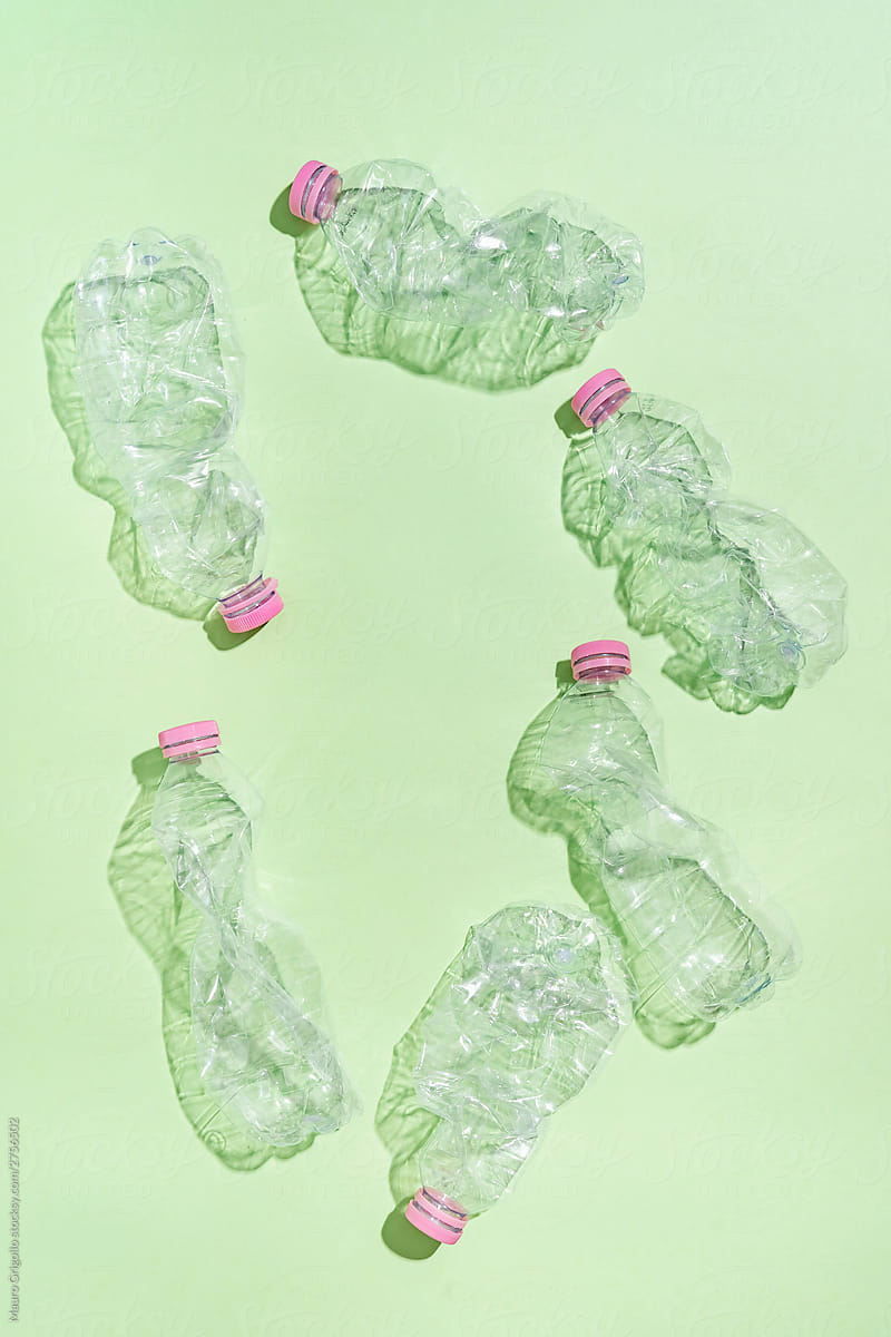 Plastic bottles on green background.