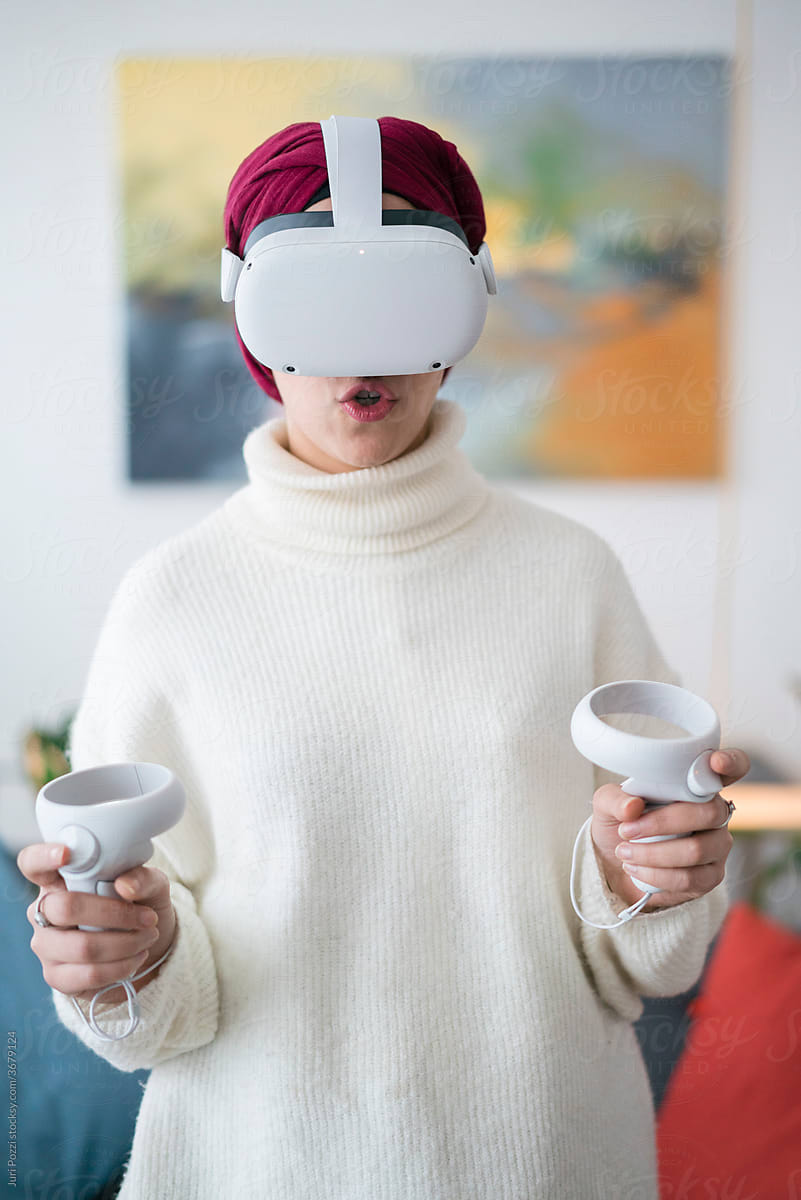Arab woman in VR headset immersing in metaverse