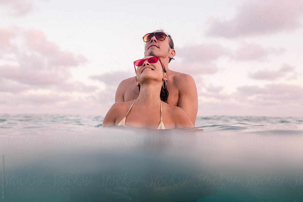 Relaxed couple enjoying sea bathing together