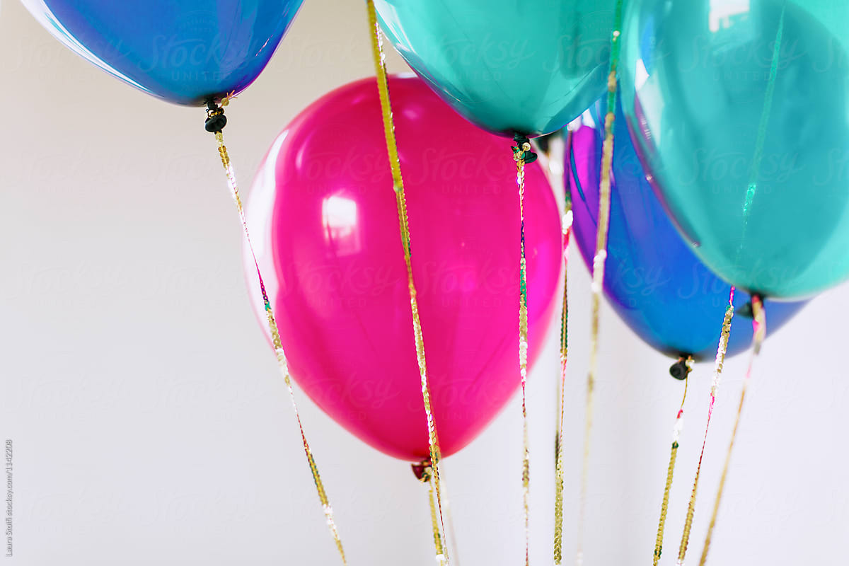 Balloons and gold sequins covered cords