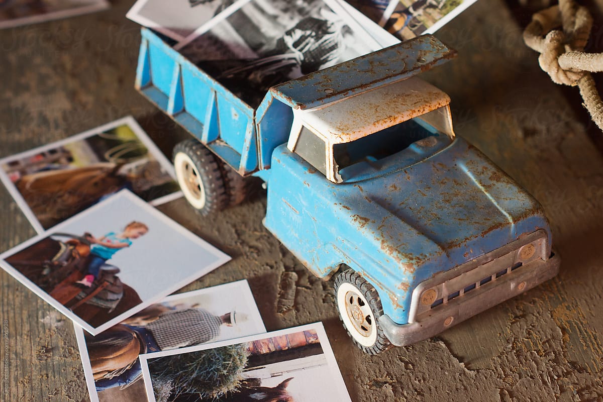 Printed images displayed in and around old toy metal pickup