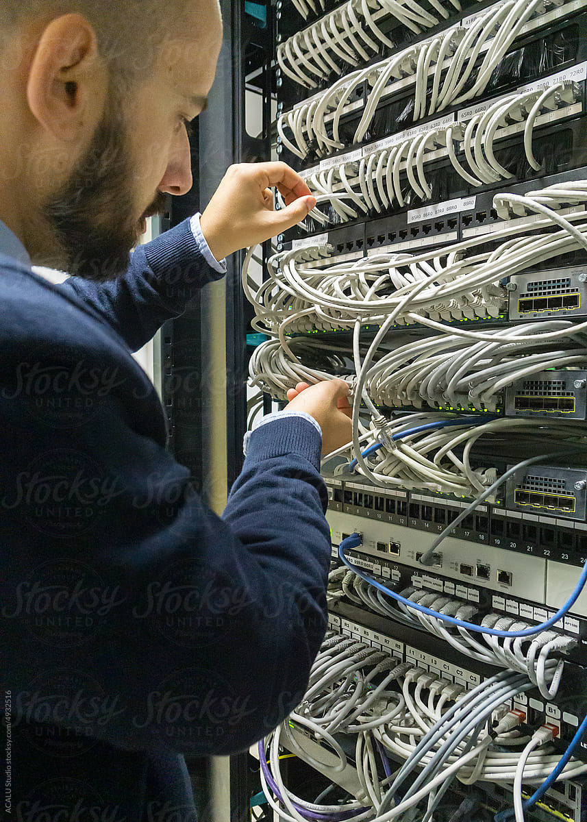 it professional fixing a communication problem in a server rack