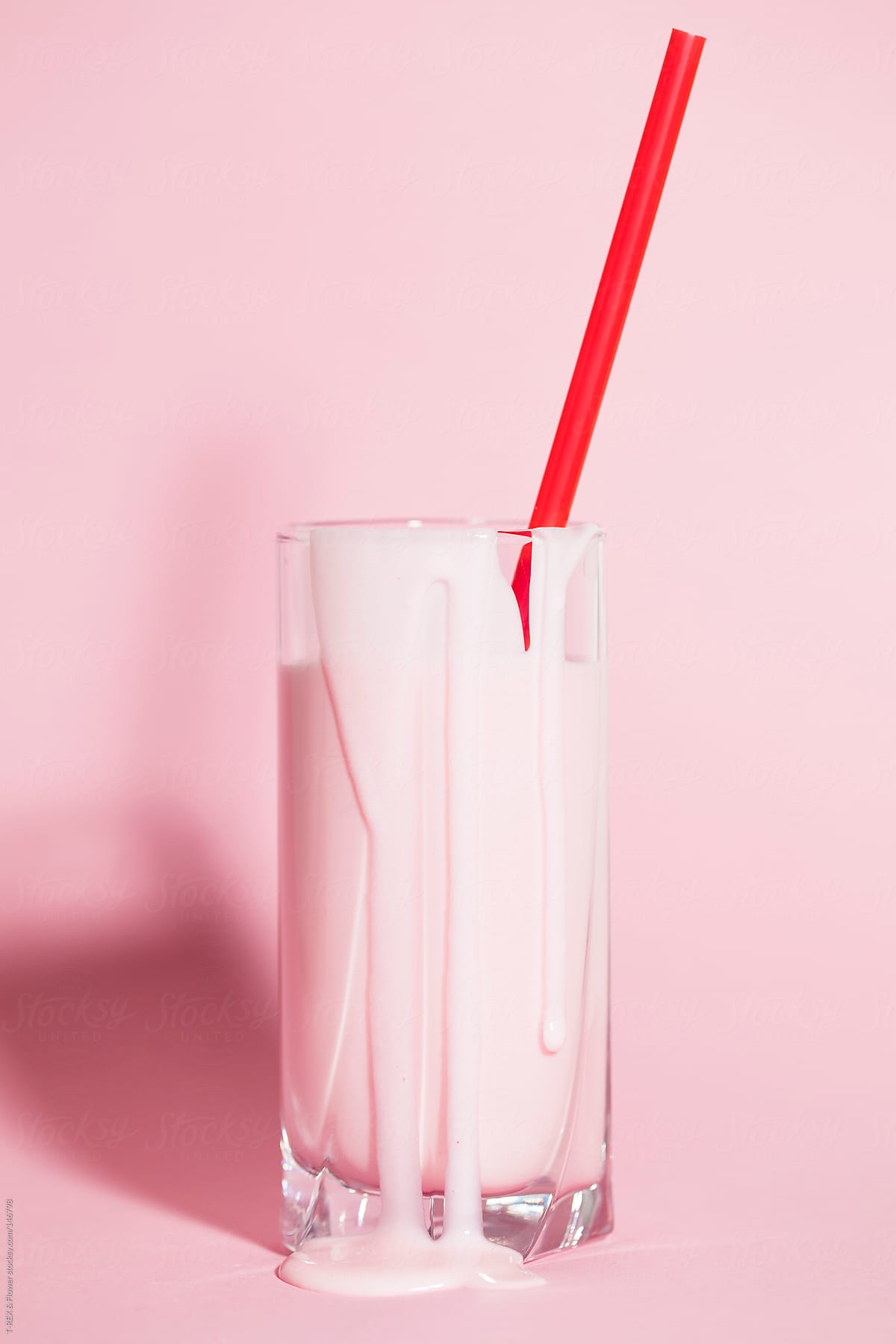 A glass of yogurt with sipping straw