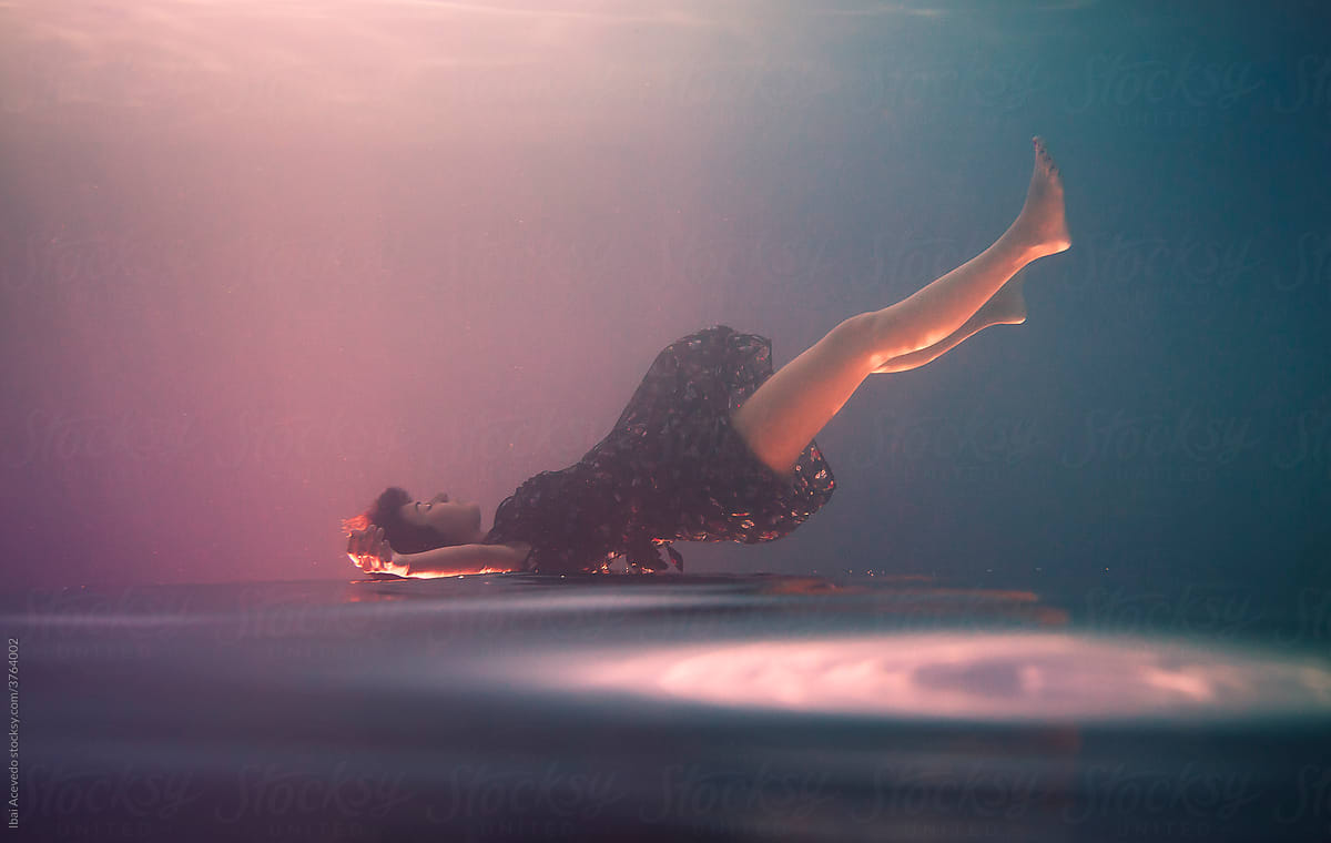 Underwater portrait of an upside down woman