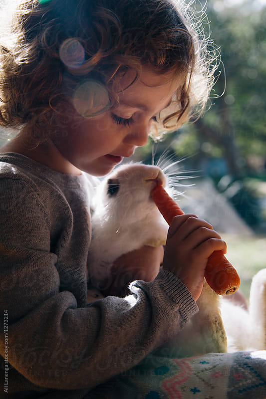 A girl and her pet rabbit