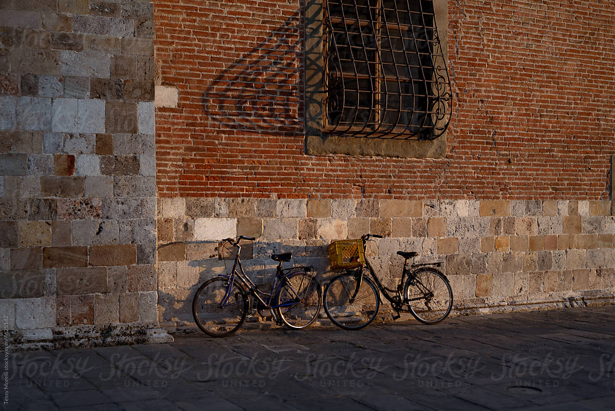 Pisa, Italy stone and brick ancient walls and bikes