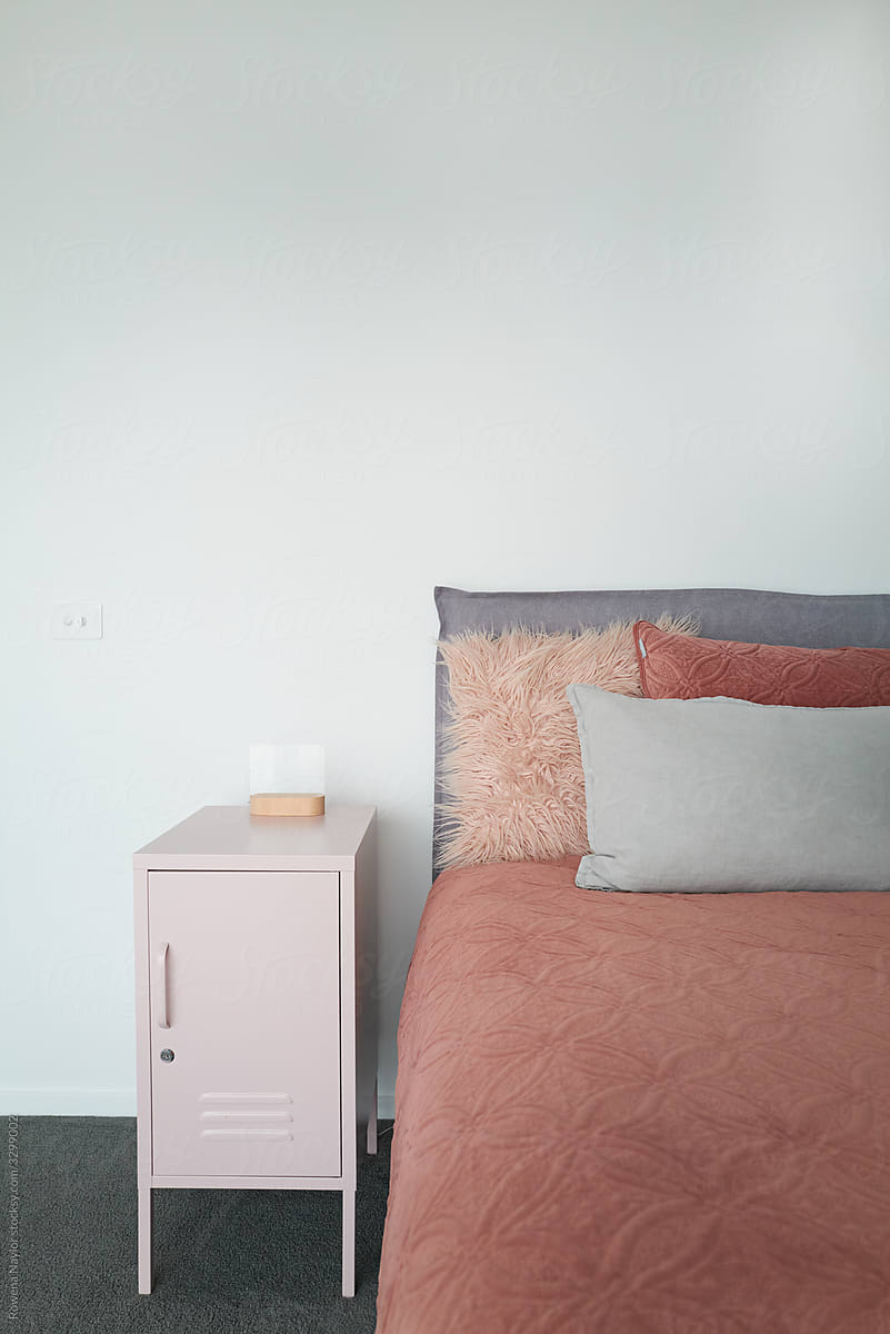 Styled girls bedroom with vintage cabinet