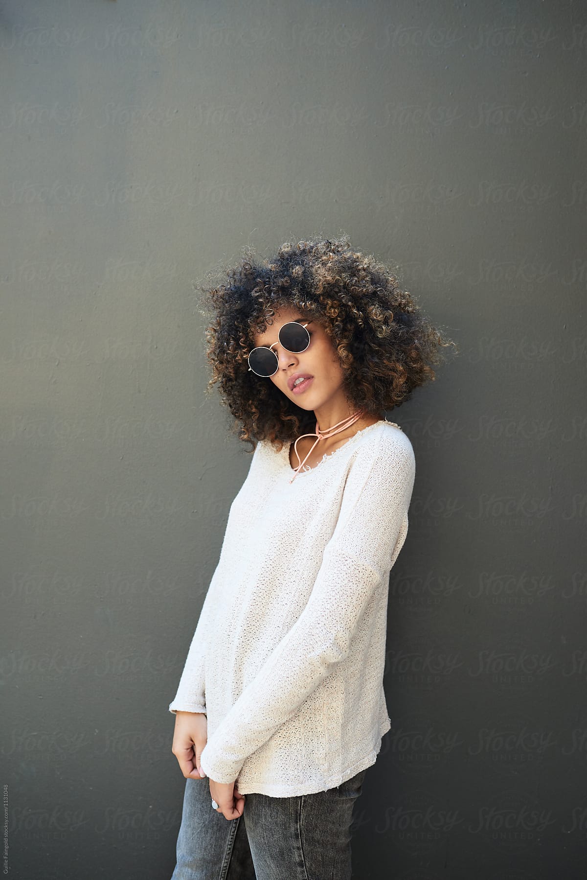 Stylish Brunette With Afro In Round Sunglasses By Stocksy Contributor Guille Faingold Stocksy