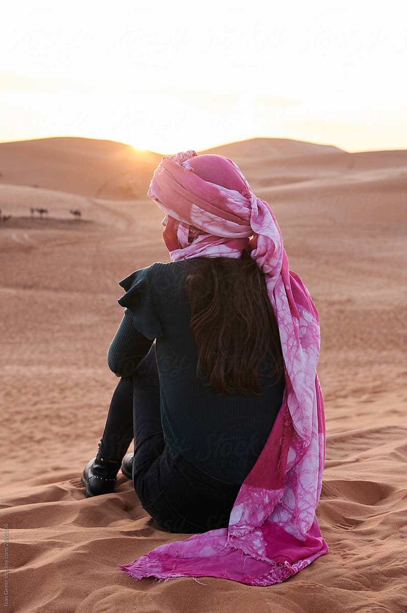 Young woman turban watch sunset desert