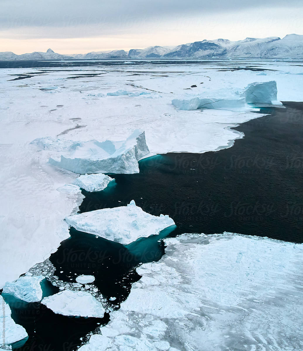 Greenland winter aerial: sea ice & iceberg, Arctic global warming