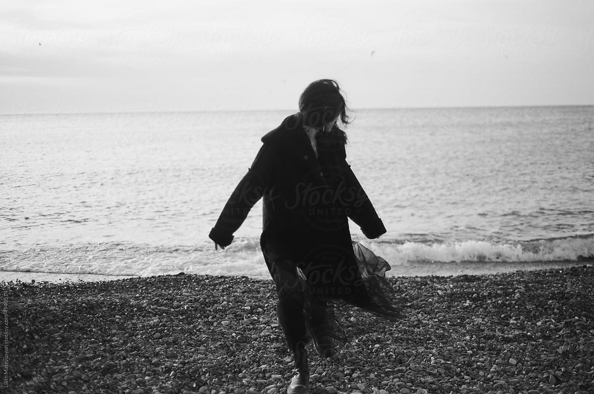 Woman on a beach in black