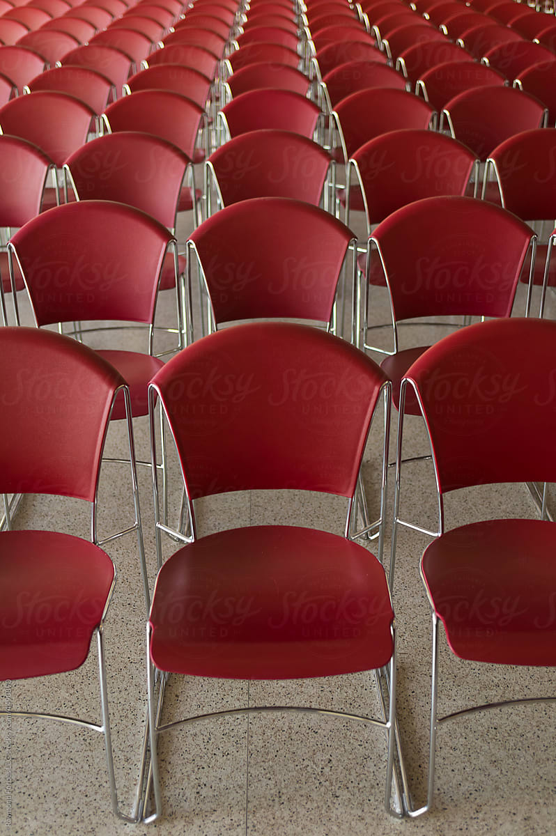 Vacant Red Chairs In a row at Business Conference Center