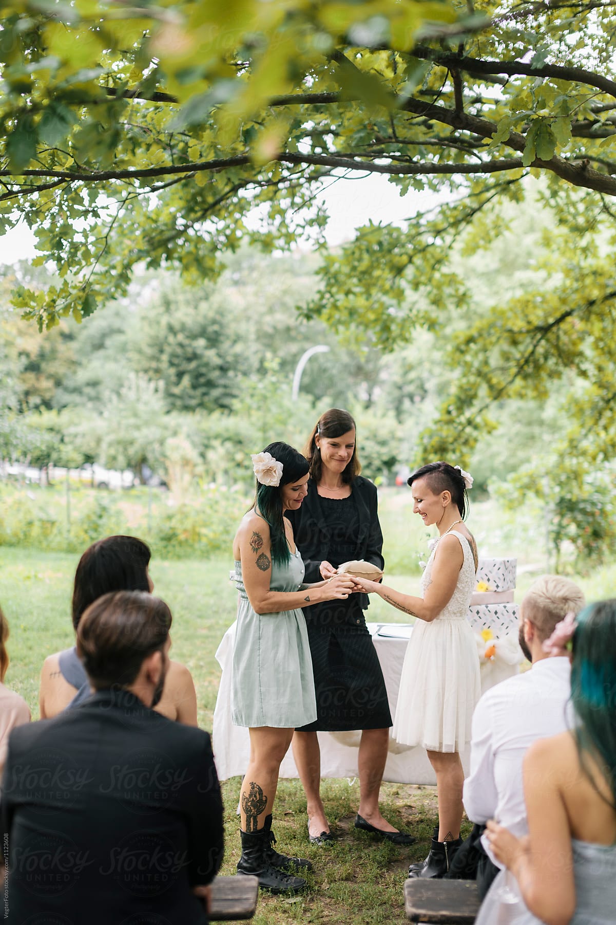 Lesbian couple exchanging rings