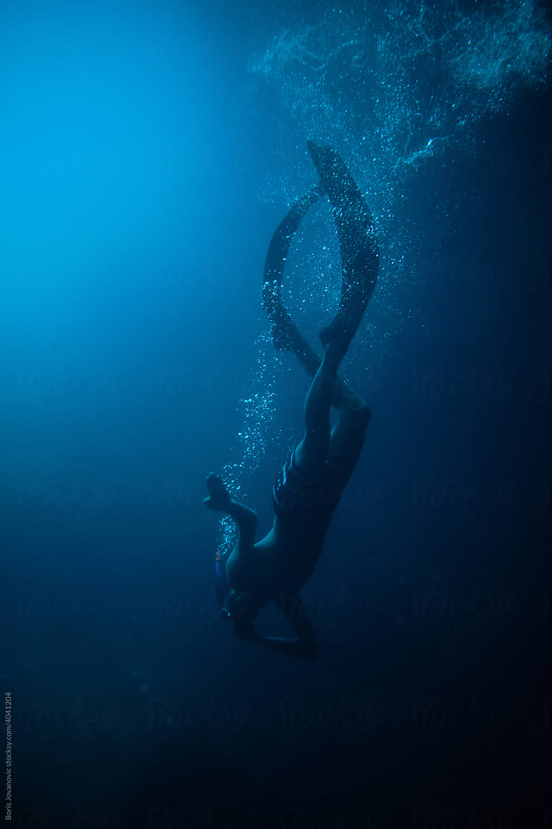 Snorkeling Diver In Deep Water