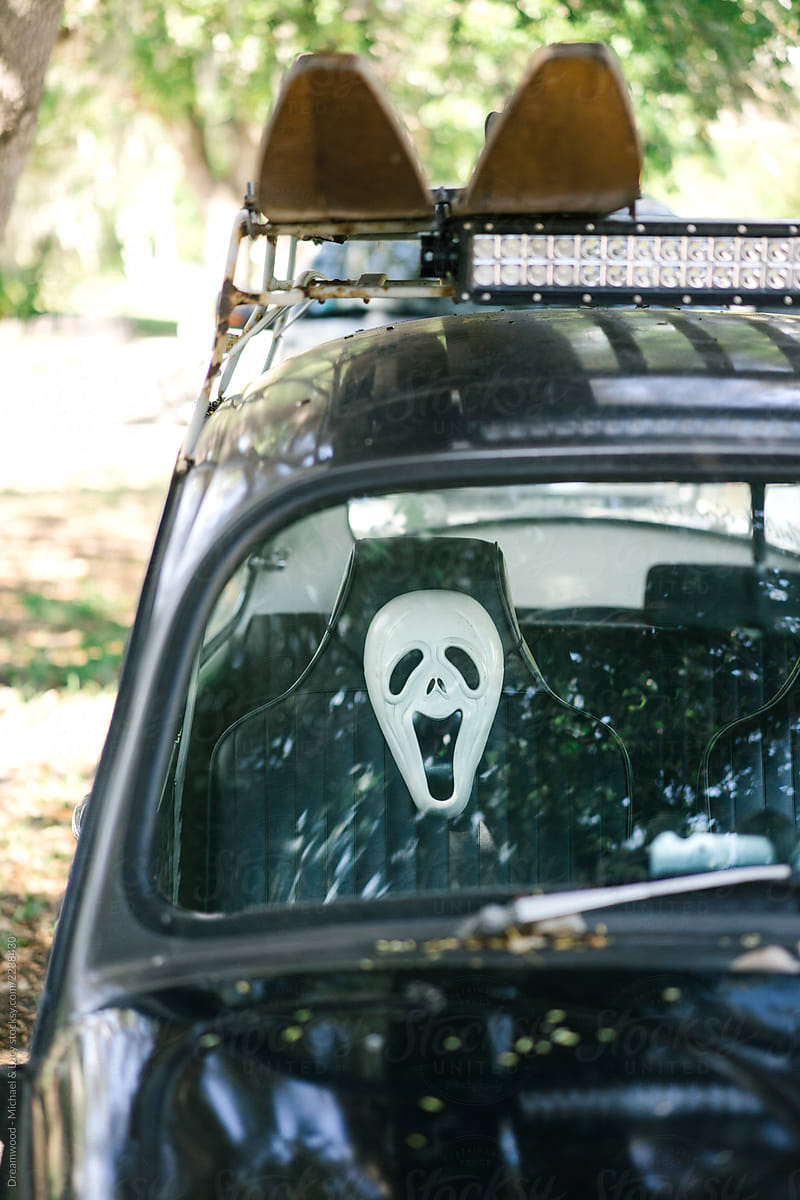 Monster mask for Halloween in the car scares passersby