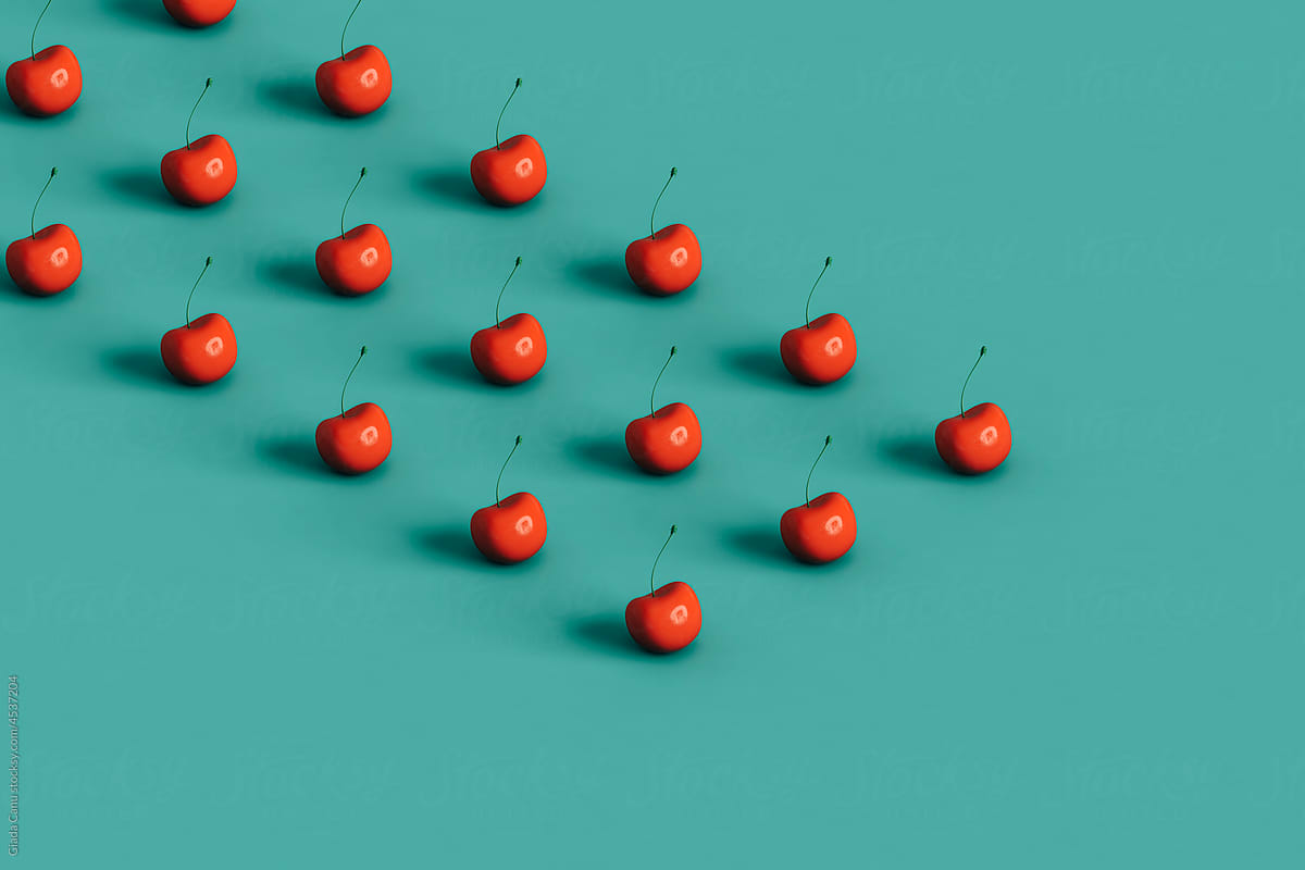 geometric shape of red cherries with copy space