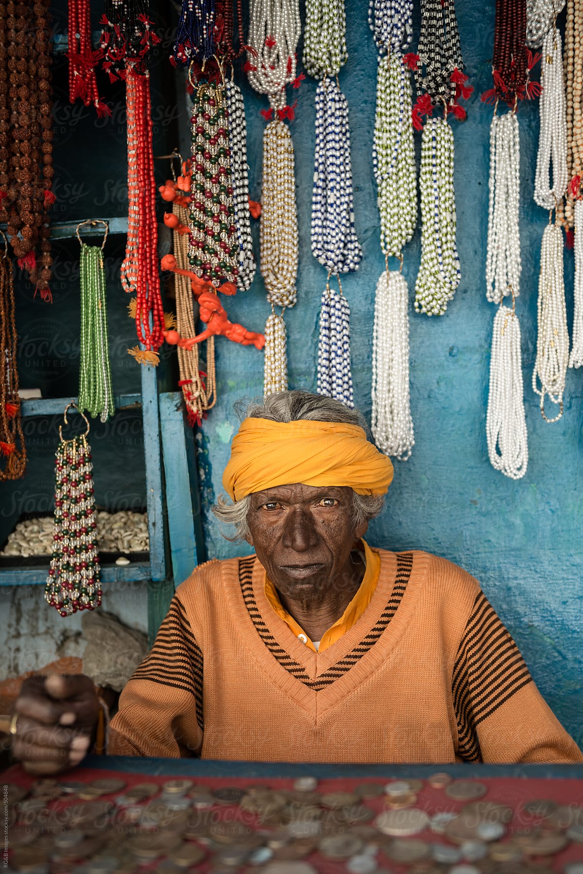old indian man in his shop
