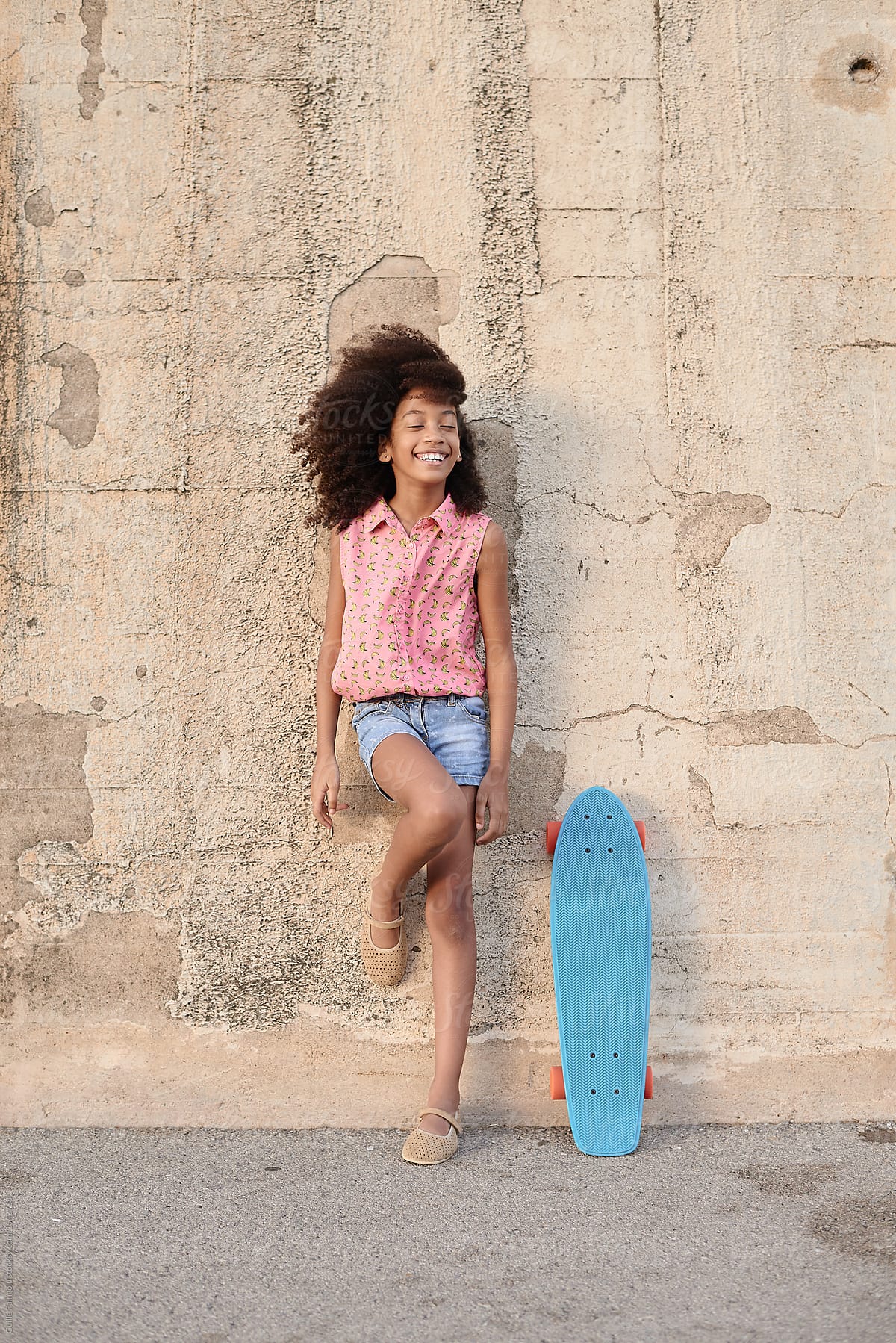 Little With Penny Board." by Stocksy Contributor "Guille Faingold" - Stocksy