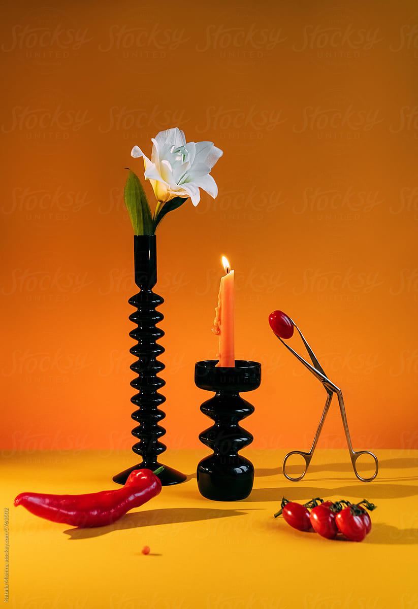 Art still life with black candlesticks.