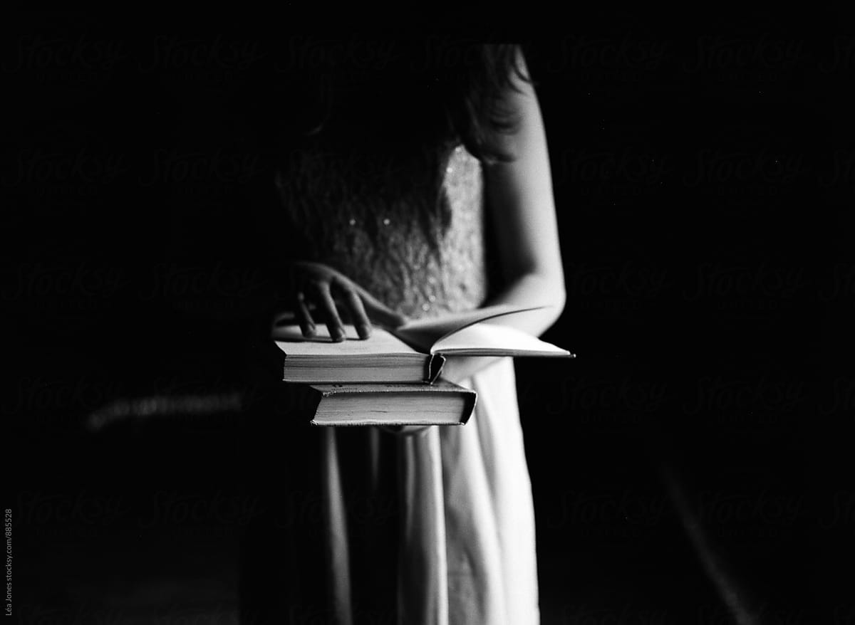 young woman holding books