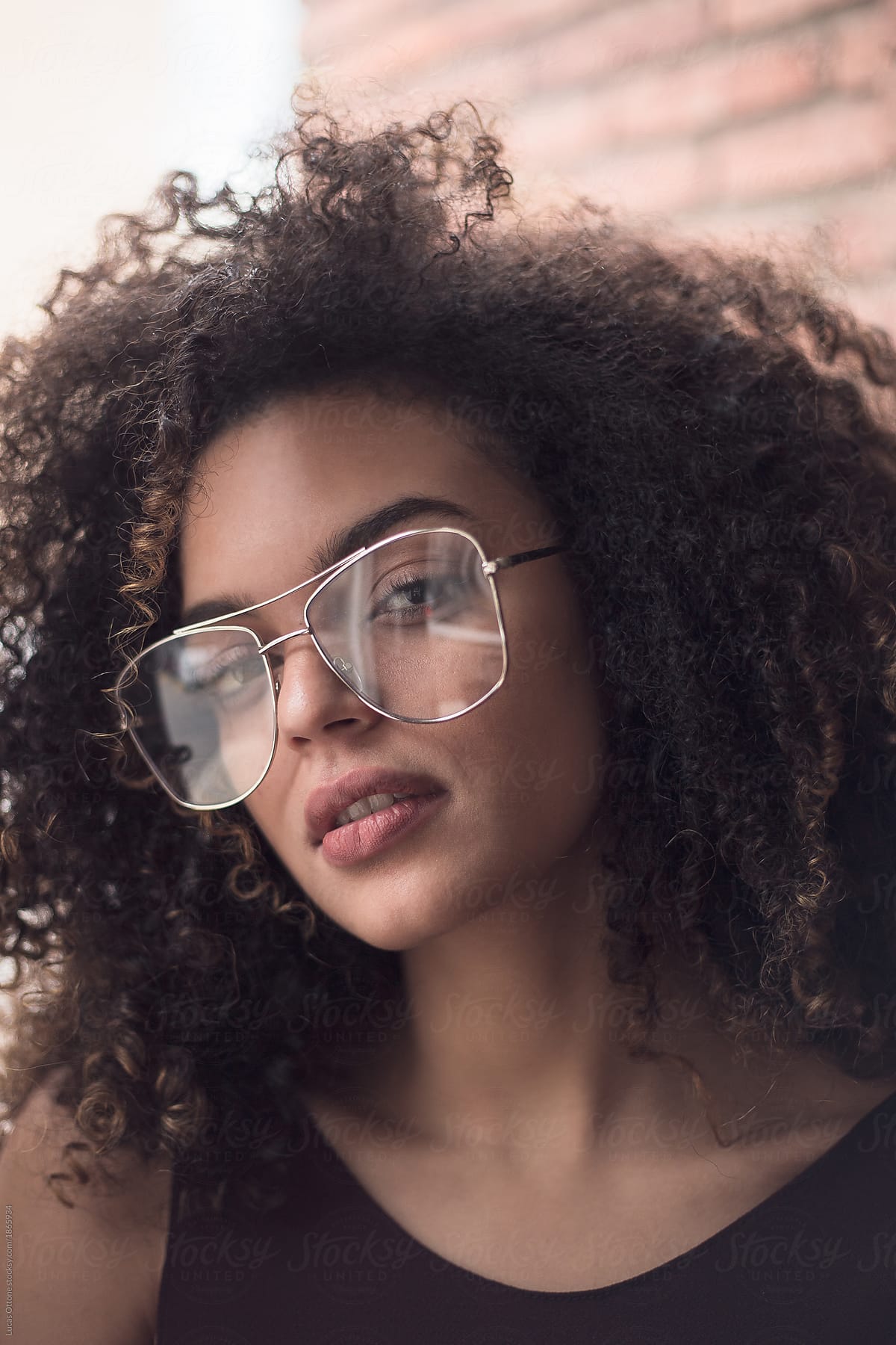 Attractive Woman With Afro Hair And Glasses By Stocksy Contributor Lucas Ottone Stocksy