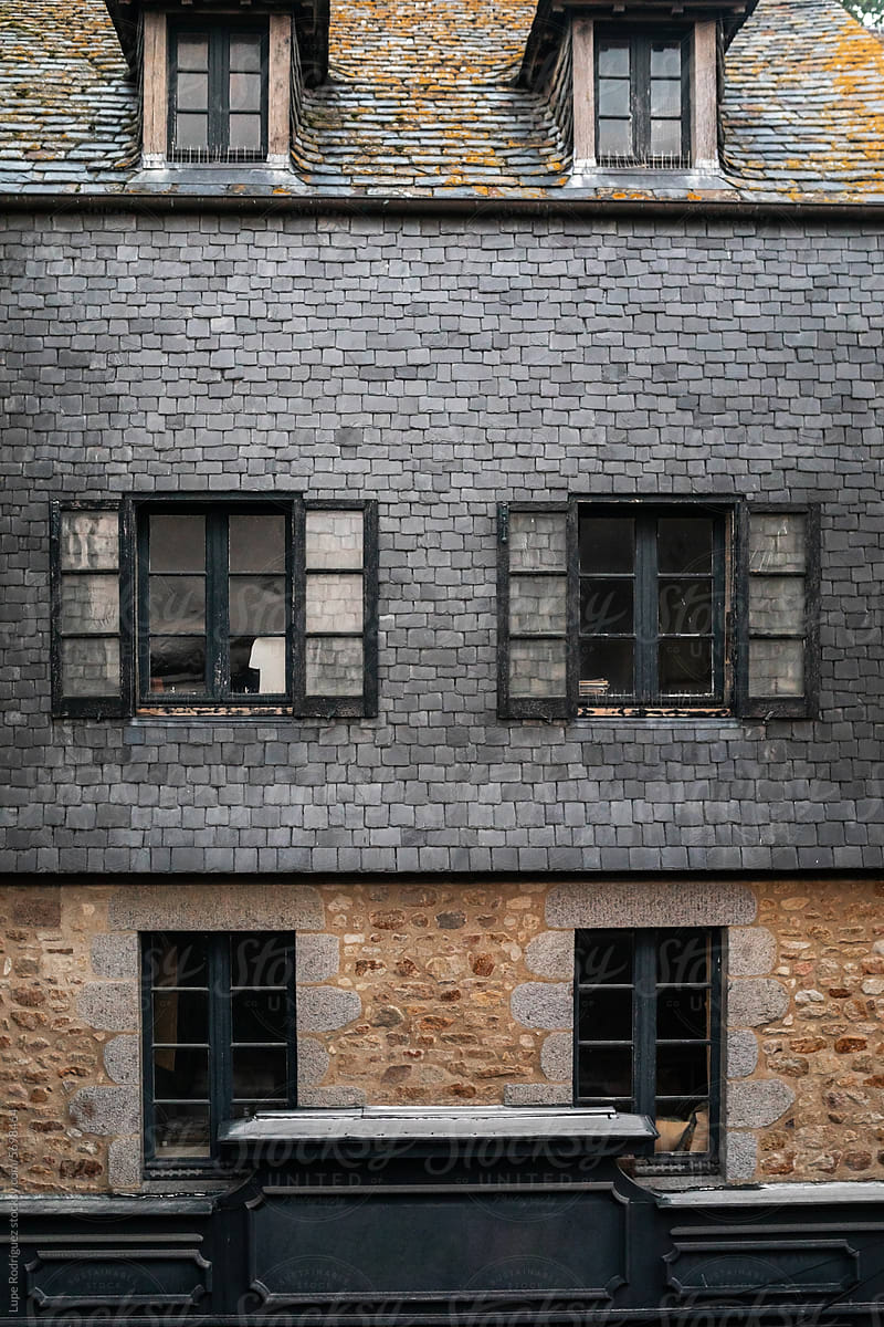 facade with windows of a house on mont saint michel in france