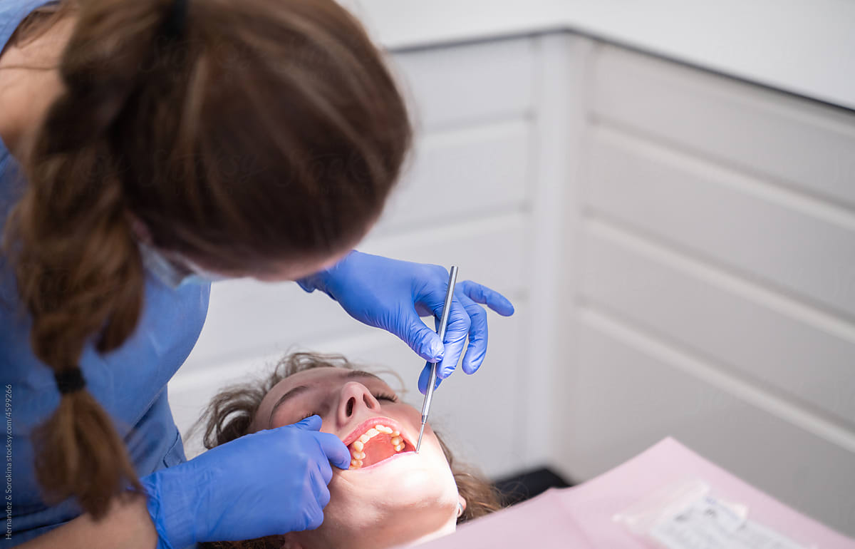 Odontologist Performing Dental Examination