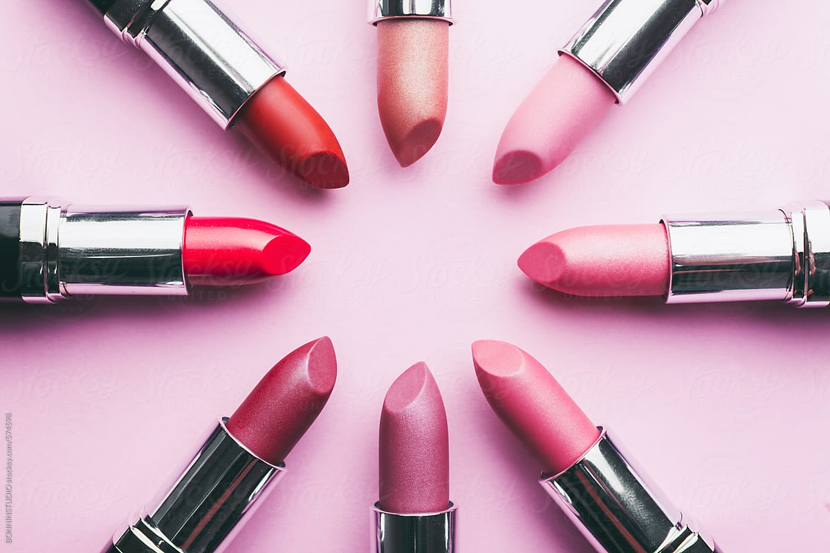 Close up of lipsticks on pink background.