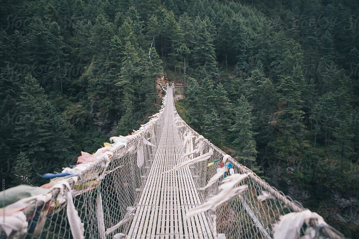A suspension bridge leading to the forest, Everest Trekking Trail, Nepal.