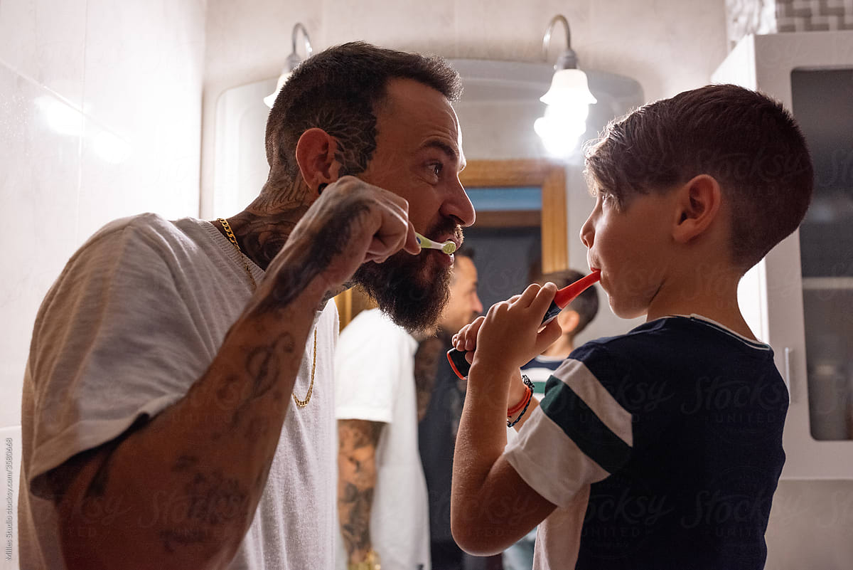 Man and boy during oral hygienic routine