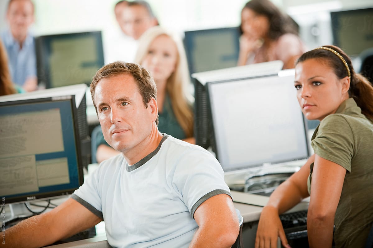 Computer Class: Adult Students Listening to Lecture