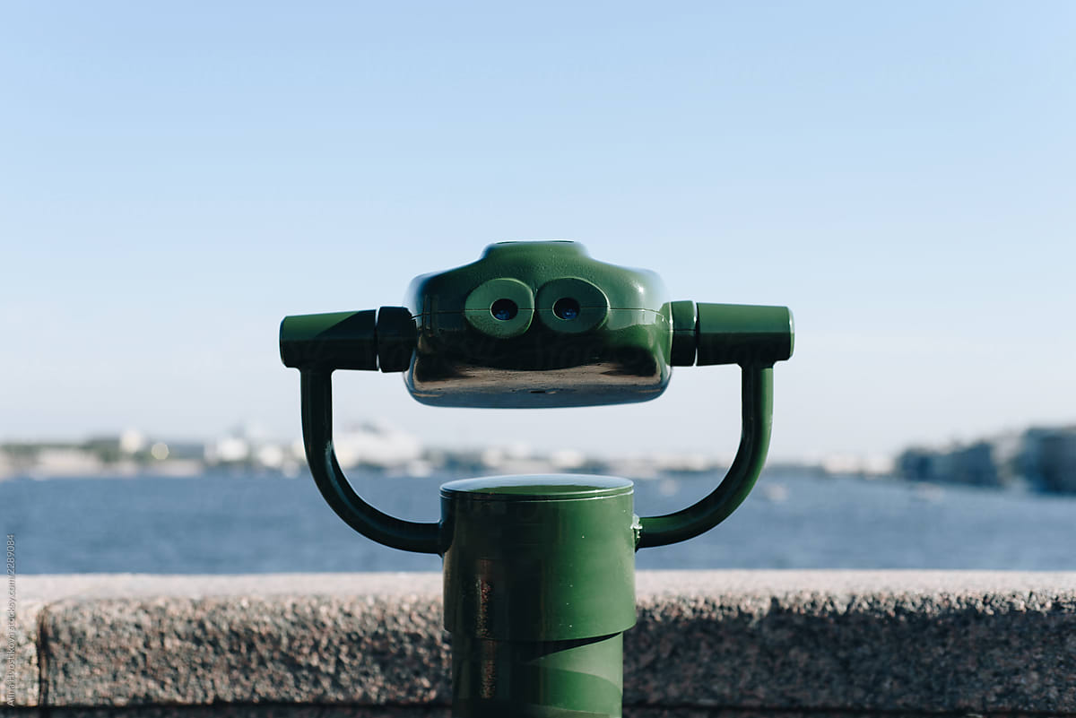 Modern binoculars on embankment
