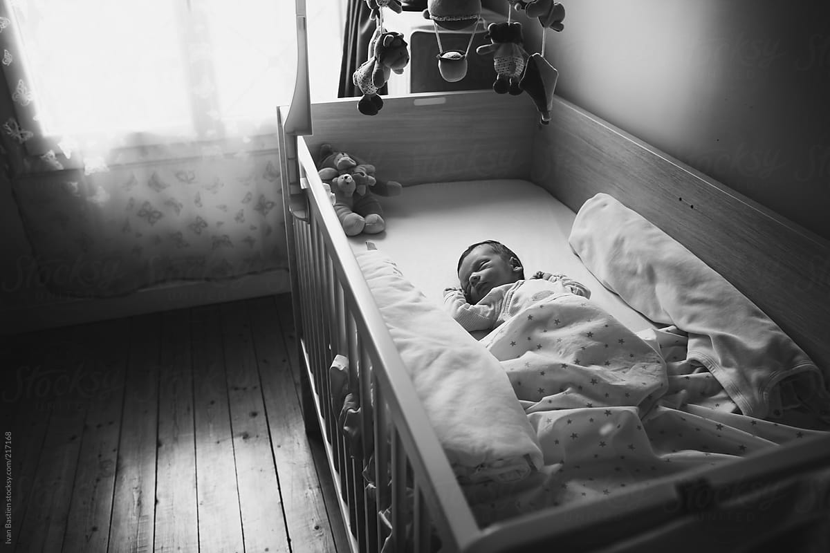 One Week Old Baby Boy Sleeping In His Bed By Stocksy Contributor One Week Old Baby Boy Sleeping In His Bed By Stocksy Contributor