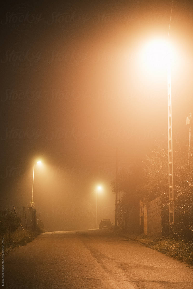 Empty road a misty night