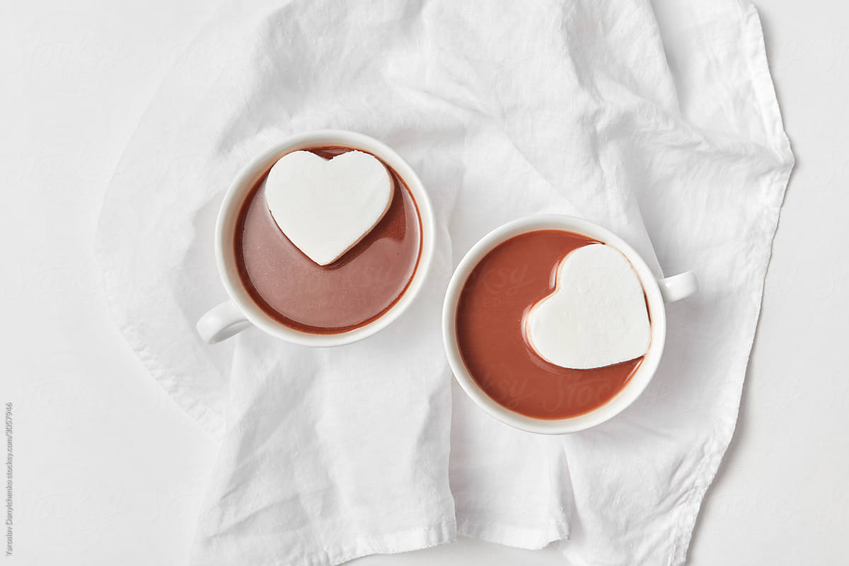 Heart cakes in two cups with chocolate.