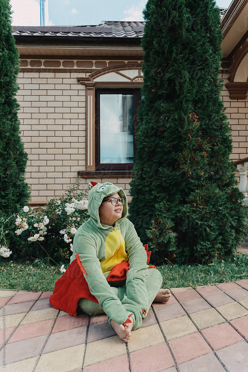 Teenager Dressed As A Dinosaur For Halloween
