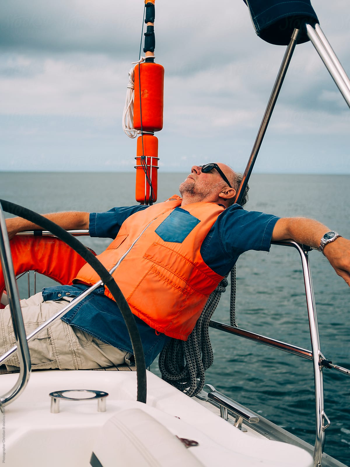 Man resting on sailing boat