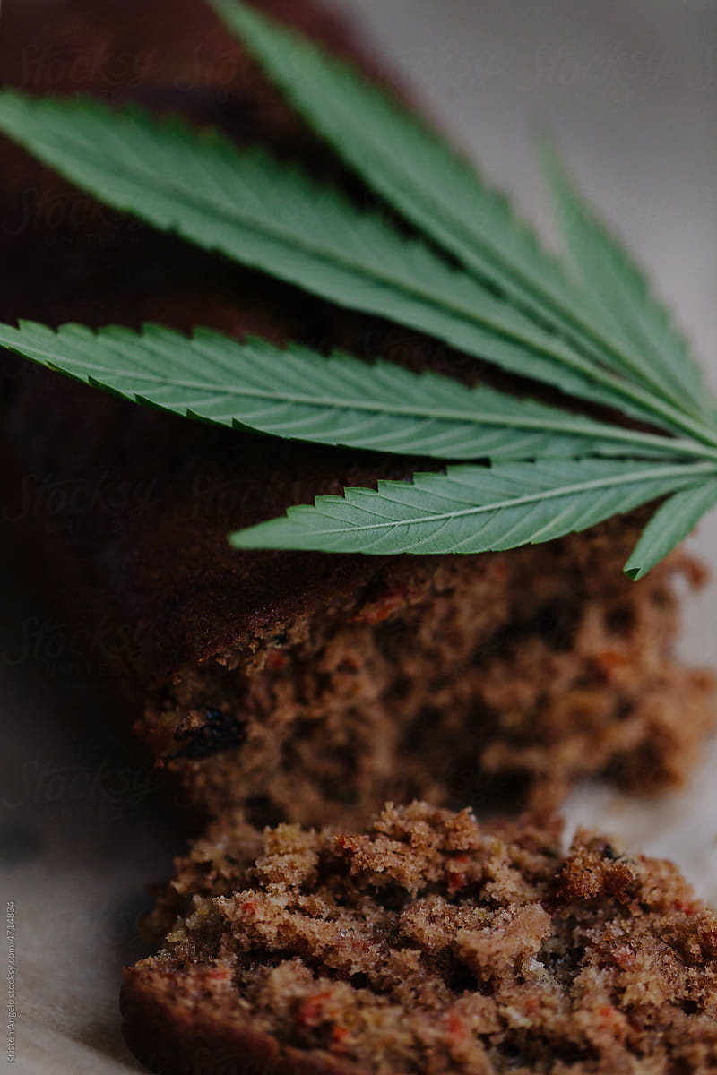 Close-up of freshly baked bread loaf with cannabis leaf