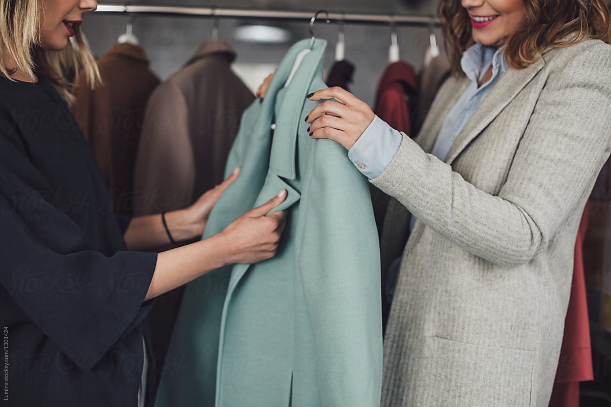 Women Choosing Coat at Shop
