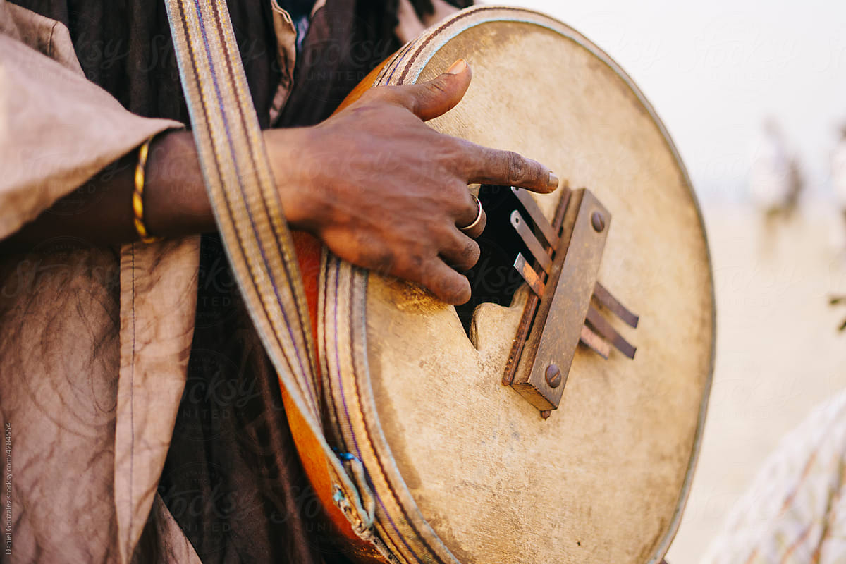 Unrecognizable African man playing mbira