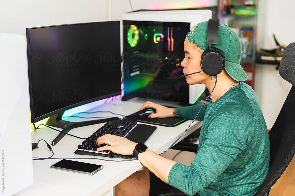 Focused gamer enjoying live stream gaming