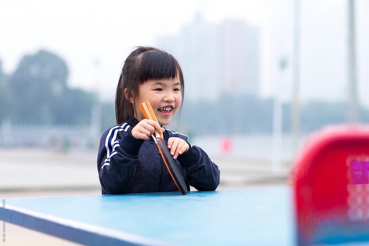 Little Asian Girl Playing Table Tennis