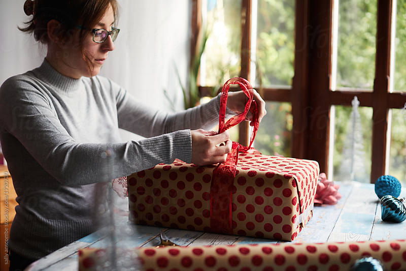 Woman wrapping a present