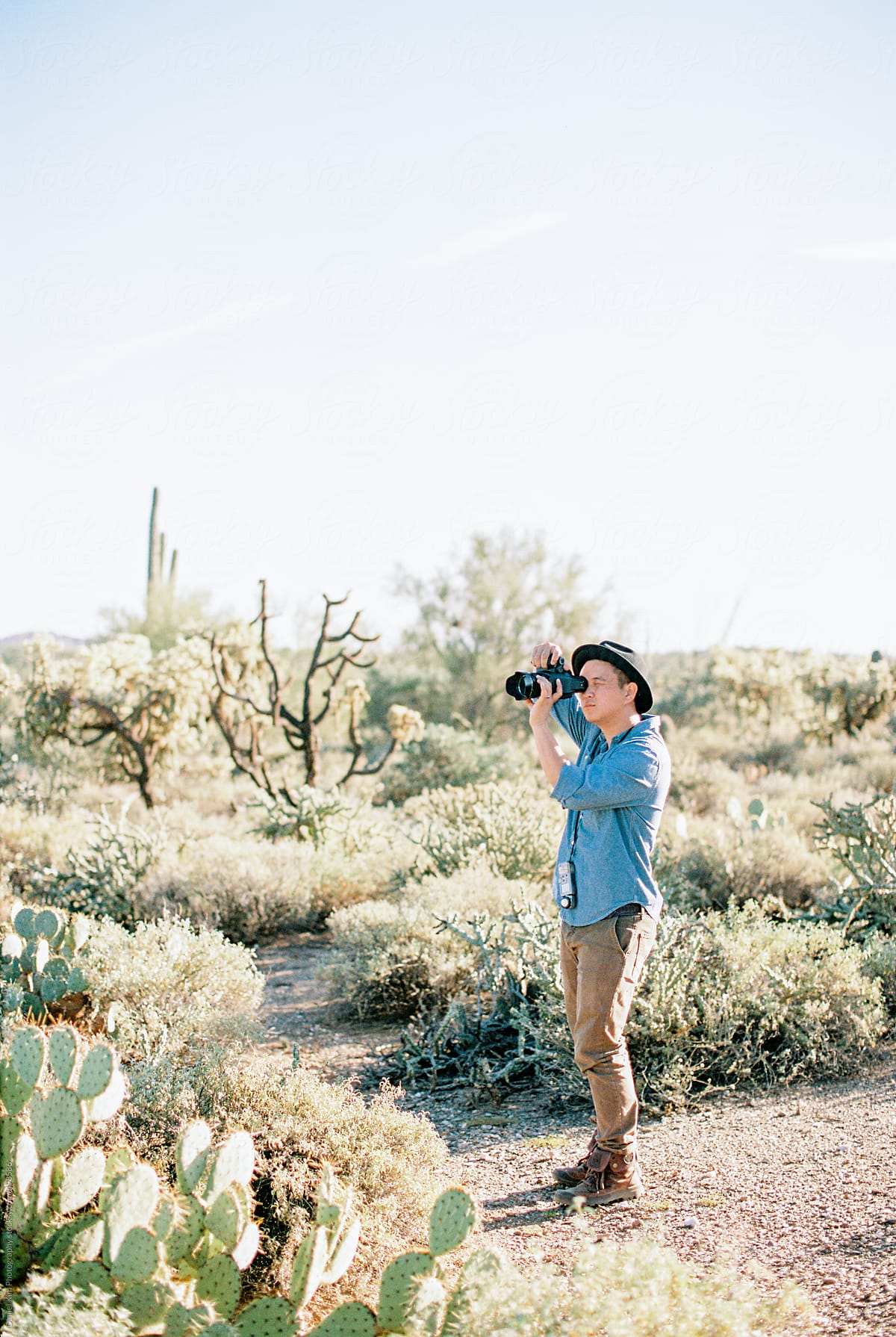 Man taking picture in desert