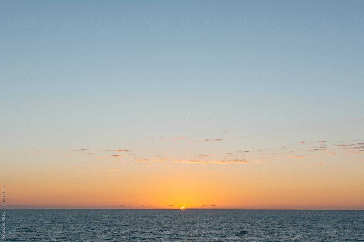 Sunset over calm ocean. California.