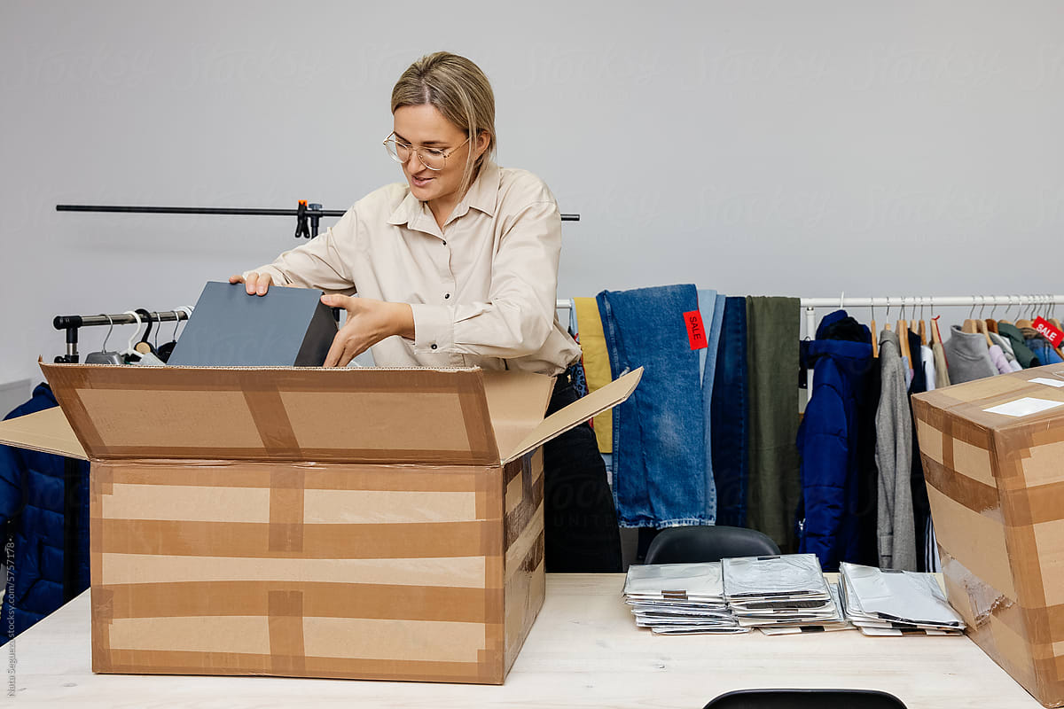 A woman unpacking a package