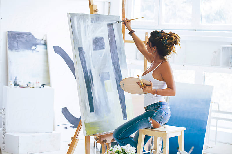 Woman Artist Painting in Her Studio