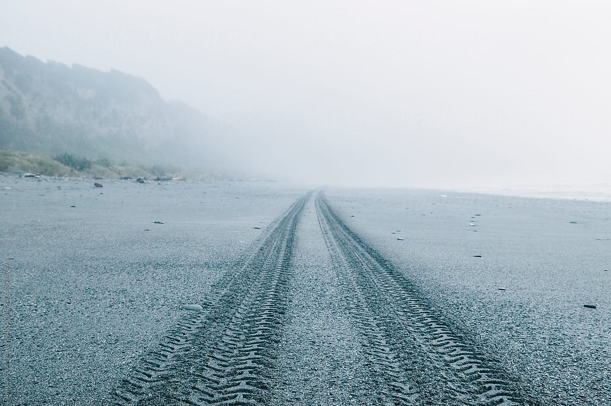 Vehicle tracks on a beach, West Coast, New Zealand.