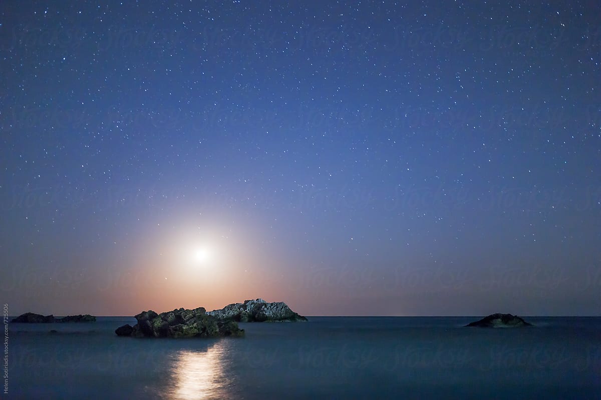 The Setting Moon over a Rocky Seascape